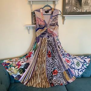 Anthropologie mixed patterned accordion dress with peep hole back.